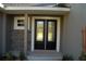 Modern double front doors with glass accents at 1712 Lake Alden Dr, Apopka, FL 32712