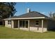 Back of house, showcasing patio and yard at 1712 Lake Alden Dr, Apopka, FL 32712