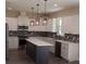Modern kitchen with white cabinets, island, and mosaic backsplash at 1712 Lake Alden Dr, Apopka, FL 32712