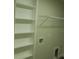 Laundry room with built-in shelving and hook at 1712 Lake Alden Dr, Apopka, FL 32712