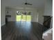 Open living room with hardwood floors and fireplace at 1712 Lake Alden Dr, Apopka, FL 32712