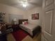 Cozy bedroom with a double bed and decorative artwork at 501 Heritage Trail St, Kissimmee, FL 34759