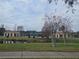 Community tennis courts and restrooms by the pond at 501 Heritage Trail St, Kissimmee, FL 34759