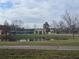 Community building with pond and flag at 501 Heritage Trail St, Kissimmee, FL 34759