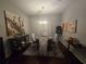 Bright dining room featuring a round table, chairs, and artwork at 501 Heritage Trail St, Kissimmee, FL 34759