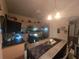 Modern kitchen with stainless steel appliances and breakfast bar at 501 Heritage Trail St, Kissimmee, FL 34759