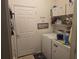 Laundry room with washer, dryer, and ample storage at 501 Heritage Trail St, Kissimmee, FL 34759