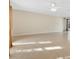 Expansive living room featuring tile flooring, ceiling fan, and neutral paint throughout at 7201 Pleasant Dr, Orlando, FL 32818
