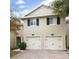 Two story townhome with two car garage and brick driveway at 10763 Regent Square Dr # 1903, Orlando, FL 32825