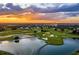 Luxury community with golf course and lake at sunset at 1364 Centre Court Ridge Dr # 201, Reunion, FL 34747