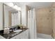 Bathroom with tub shower combination and granite countertop at 1364 Centre Court Ridge Dr # 201, Reunion, FL 34747