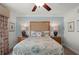 Bedroom with queen-size bed and coastal decor at 1364 Centre Court Ridge Dr # 201, Reunion, FL 34747