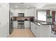 Modern kitchen with stainless steel appliances and granite countertops at 1364 Centre Court Ridge Dr # 201, Reunion, FL 34747