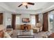 Spacious living room with large windows and comfortable seating at 1364 Centre Court Ridge Dr # 201, Reunion, FL 34747