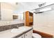 Bathroom with sink, vanity, medicine cabinet, and shower with tub at 14025 Royal Fern Way, Astatula, FL 34705