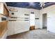 View of empty bedroom, shelves, and natural light from window at 14025 Royal Fern Way, Astatula, FL 34705