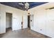 Empty bedroom features ceiling fan, carpet, and two doorways at 14025 Royal Fern Way, Astatula, FL 34705