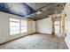 View of an empty living room with carpet and natural light at 14025 Royal Fern Way, Astatula, FL 34705