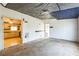 Empty living room with open door and a view of kitchen at 14025 Royal Fern Way, Astatula, FL 34705