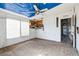 Living room with large windows, carpet, and an open doorway at 14025 Royal Fern Way, Astatula, FL 34705