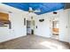 Spacious living room features a ceiling fan and multiple doorways at 14025 Royal Fern Way, Astatula, FL 34705