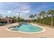 A community pool with brick pavers, palm trees, pool house and lots of seating at 14025 Royal Fern Way, Astatula, FL 34705