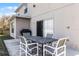 Cozy outdoor patio with seating and a grill, perfect for enjoying the backyard at 1907 Lakeview Way, Kissimmee, FL 34759
