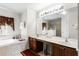 Spacious bathroom boasts double sinks, a soaking tub, walk-in shower, and ample counter space at 1907 Lakeview Way, Kissimmee, FL 34759