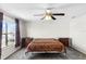 Relaxing bedroom features a ceiling fan, a cozy bed, and dual nightstands on either side of the bed at 1907 Lakeview Way, Kissimmee, FL 34759
