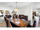 Elegant dining room with a decorative table setting and stylish chandelier at 1907 Lakeview Way, Kissimmee, FL 34759