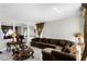 Comfortable living room featuring a large sectional sofa and decorative accent tables at 1907 Lakeview Way, Kissimmee, FL 34759