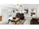 Spacious living room with access to the backyard, tile floors, and kitchen access at 1907 Lakeview Way, Kissimmee, FL 34759
