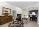 Comfortable living room with elegant decor, decorative buffet, and an archway leading to the dining room at 1907 Lakeview Way, Kissimmee, FL 34759