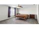Neutral main bedroom with plush carpet, neutral paint, a window, and traditional furnishings at 1907 Lakeview Way, Kissimmee, FL 34759