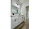 Elegant bathroom with double vanity sinks, granite countertops, and modern fixtures at 350 Marion Oaks Pass, Ocala, FL 34473