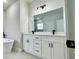 Elegant bathroom featuring double vanity, modern lighting, and a freestanding tub at 350 Marion Oaks Pass, Ocala, FL 34473