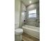 Bright bathroom featuring a tub and shower with marble style tile at 350 Marion Oaks Pass, Ocala, FL 34473