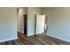 Bright, empty bedroom with wood-look flooring, and two closets at 350 Marion Oaks Pass, Ocala, FL 34473