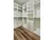 Bright walk-in closet featuring custom shelving, drawers, and ample storage space at 350 Marion Oaks Pass, Ocala, FL 34473
