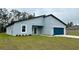 Charming one-story home with a well-manicured lawn and inviting blue garage door at 350 Marion Oaks Pass, Ocala, FL 34473