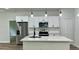 Modern kitchen featuring white cabinets, stainless steel appliances, and a center island at 350 Marion Oaks Pass, Ocala, FL 34473