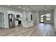 Open-concept living space with modern finishes and a seamless flow to the kitchen at 350 Marion Oaks Pass, Ocala, FL 34473