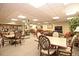 Community room with tables, chairs, kitchen, and relaxing lounge area at 400 E Colonial Dr # 207, Orlando, FL 32803