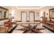 Lobby area with elevators, seating, and a beautiful star-patterned floor at 400 E Colonial Dr # 207, Orlando, FL 32803