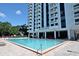 Inviting pool area and building exterior of Park Lake Towers at 400 E Colonial Dr # 207, Orlando, FL 32803