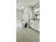 Modern bathroom featuring a freestanding tub and white vanity with a large mirror at 559 Marion Oaks Blvd, Ocala, FL 34473