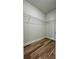 Walk-in closet with wire shelving and wood-look flooring at 559 Marion Oaks Blvd, Ocala, FL 34473