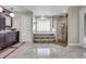 Bright bathroom with a soaking tub set in a glass block window, plus a separate glassed-in shower at 8048 Canyon Lake Cir, Orlando, FL 32835
