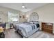 Guest bedroom with a window desk and a bookshelf and a fluffy white rug at 8048 Canyon Lake Cir, Orlando, FL 32835
