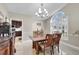 Elegant dining room with a chandelier, wooden table, and comfortable seating, great for gatherings at 8048 Canyon Lake Cir, Orlando, FL 32835